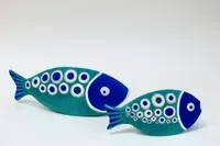 Photo of Two turquoise and teal spotty fish